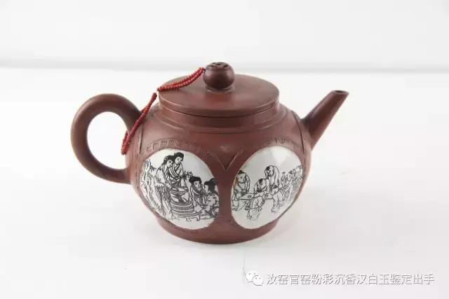 深圳永乐惊鸿一现”项圣思清开光婴戏纹紫砂壶”