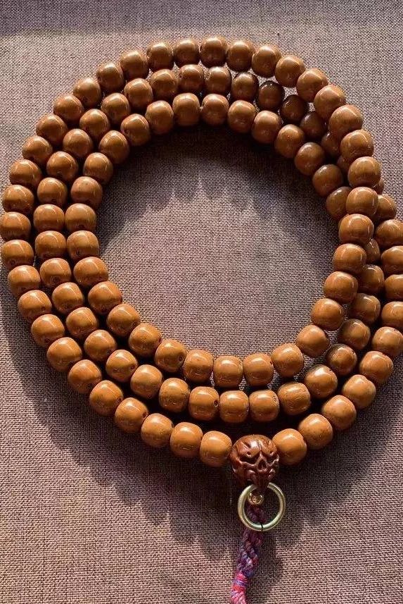 沉香手串包浆好还是不包浆好,怎样分辨包浆和不包浆的手串