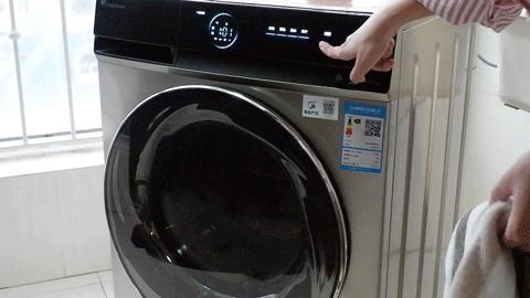 滚筒洗衣机出脏东西的口打不开了,洗衣机有个长方形小盒子