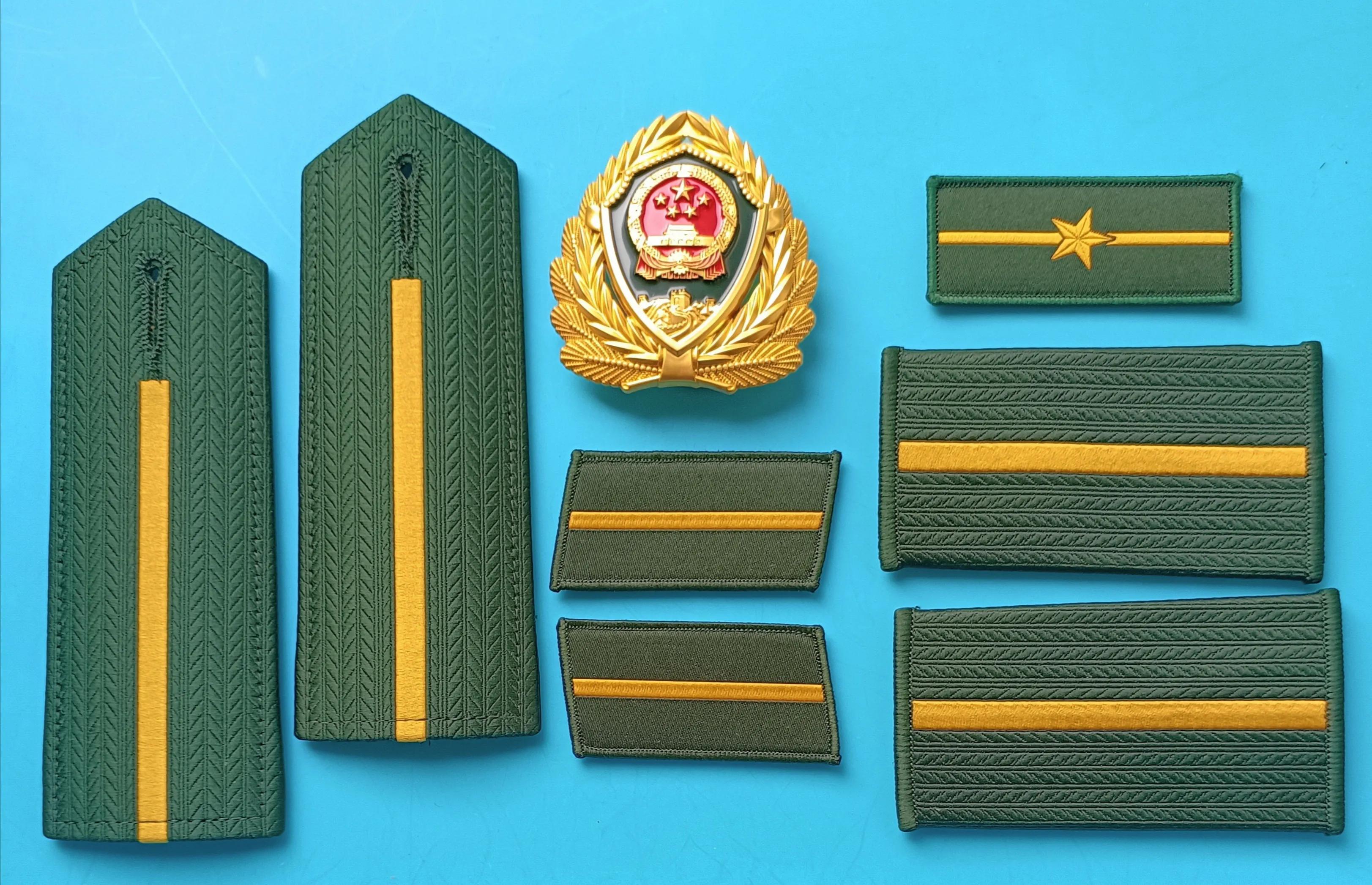 毛启国军装,毛启国警用帽徽